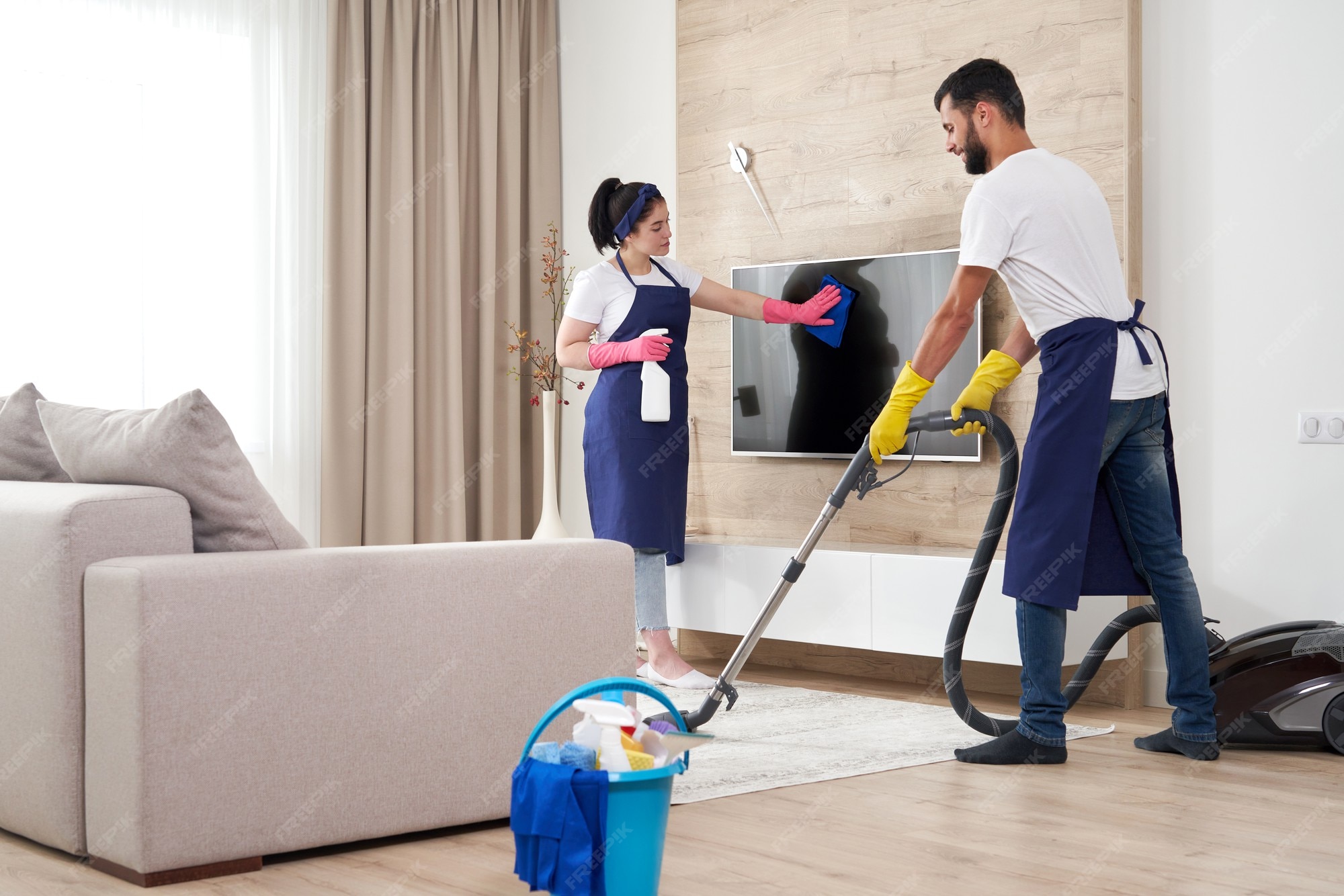 Premium Photo | Professional cleaning service team cleans living room in modern apartment